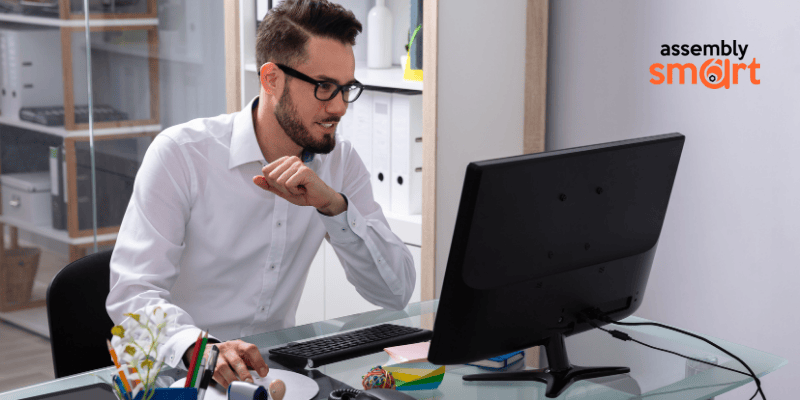 man working at computer desk